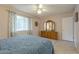 Bedroom with window, dresser and ceiling fan at 10027 W Concord Ave, Sun City, AZ 85351