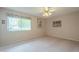 Bedroom with ceiling fan and large closet at 10027 W Concord Ave, Sun City, AZ 85351