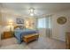 Bedroom with wooden furniture and neutral decor at 10027 W Concord Ave, Sun City, AZ 85351