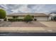 House exterior showcasing a well-maintained front yard and driveway at 10027 W Concord Ave, Sun City, AZ 85351