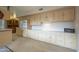 Kitchen boasts extensive counter and cabinet space at 10027 W Concord Ave, Sun City, AZ 85351