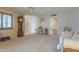 Bright living room with a ceiling fan, comfortable seating, and a view into the kitchen at 10027 W Concord Ave, Sun City, AZ 85351