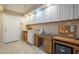 Home office with built-in cabinetry and desk space at 10027 W Concord Ave, Sun City, AZ 85351