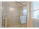 Shower with glass enclosure and towel bar at 10027 W Concord Ave, Sun City, AZ 85351