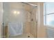 Shower stall with glass door and shelf at 10027 W Concord Ave, Sun City, AZ 85351