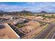 Aerial view of a house with a large lot, RV parking, and a horse corral at 10447 W Appaloosa Trl, Casa Grande, AZ 85194