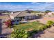 Aerial view of house, yard, and surrounding landscape at 10447 W Appaloosa Trl, Casa Grande, AZ 85194