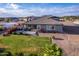 Aerial view showing house, green lawn, and desert landscape at 10447 W Appaloosa Trl, Casa Grande, AZ 85194