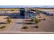 Aerial view showcasing a house with a detached garage and nicely landscaped yard at 10447 W Appaloosa Trl, Casa Grande, AZ 85194