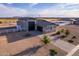 An aerial view of a house with a large yard, RV parking, and a detached garage at 10447 W Appaloosa Trl, Casa Grande, AZ 85194