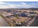 Aerial view of a house with a large lot, RV parking, and a horse corral at 10447 W Appaloosa Trl, Casa Grande, AZ 85194