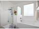 Clean bathroom featuring a shower, bathtub, and a window at 10447 W Appaloosa Trl, Casa Grande, AZ 85194