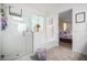 Bathroom with shower, bathtub, and view into bedroom at 10447 W Appaloosa Trl, Casa Grande, AZ 85194