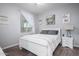 Charming bedroom with white sleigh bed and gray accents at 10447 W Appaloosa Trl, Casa Grande, AZ 85194