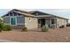 Gray house exterior with landscaping and a covered porch at 10447 W Appaloosa Trl, Casa Grande, AZ 85194