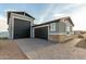 House exterior showcasing a large garage and brick accents at 10447 W Appaloosa Trl, Casa Grande, AZ 85194