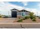 House exterior with a paved driveway and landscaping at 10447 W Appaloosa Trl, Casa Grande, AZ 85194