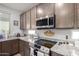 Kitchen with granite countertops and stainless steel appliances at 10447 W Appaloosa Trl, Casa Grande, AZ 85194