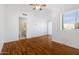 Bedroom with bathroom access and wood flooring at 10836 N 29Th Ave, Phoenix, AZ 85029