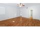 Bright bedroom with wood-look flooring and access to bathroom at 10836 N 29Th Ave, Phoenix, AZ 85029