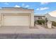 Condo exterior featuring a garage and landscaped walkway at 10836 N 29Th Ave, Phoenix, AZ 85029