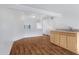 Bright kitchenette featuring wood cabinets and laminate floors at 10836 N 29Th Ave, Phoenix, AZ 85029