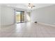 Living room with tile floor and sliding glass door to patio at 10836 N 29Th Ave, Phoenix, AZ 85029