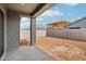 Covered patio overlooking a spacious backyard with a block wall, offering a blank canvas for creating an outdoor oasis at 11441 E Utah Ave, Mesa, AZ 85212