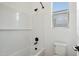 Clean bathroom showcases a white subway tile shower, black shower head, and a functional design at 11441 E Utah Ave, Mesa, AZ 85212