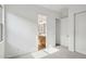 Spacious bedroom with carpet flooring leading to ensuite bath and closet at 11441 E Utah Ave, Mesa, AZ 85212