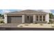 One-story home with a two-car garage and neutral color palette at 11441 E Utah Ave, Mesa, AZ 85212