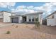 Contemporary home featuring drought-resistant landscaping and a side view at 11441 E Utah Ave, Mesa, AZ 85212