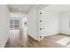 Bright foyer with light wood-look floors and a view into the living spaces at 11441 E Utah Ave, Mesa, AZ 85212
