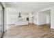 Open concept kitchen with white cabinets, stainless steel appliances, and modern finishes at 11441 E Utah Ave, Mesa, AZ 85212