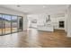 Modern kitchen seamlessly connects to the living area, featuring stainless appliances and a center island at 11441 E Utah Ave, Mesa, AZ 85212