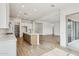 Open concept kitchen with updated island and stainless appliances leading into the living space at 11441 E Utah Ave, Mesa, AZ 85212