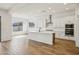 Bright kitchen with a large island, white cabinetry, and stainless steel appliances at 11441 E Utah Ave, Mesa, AZ 85212