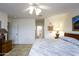 Main bedroom with ensuite bathroom access and ceiling fan at 11461 E Natal Ave, Mesa, AZ 85209