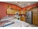 Bright kitchen with wood cabinets and a double sink at 11461 E Natal Ave, Mesa, AZ 85209