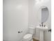 Powder room with pedestal sink and toilet at 11464 E Utah Ave, Mesa, AZ 85212