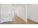 Clean and bright hallway with tile flooring and white walls at 11464 E Utah Ave, Mesa, AZ 85212