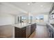 Modern kitchen with island, stainless steel appliances, and white quartz countertops at 11464 E Utah Ave, Mesa, AZ 85212