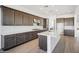 Modern kitchen with dark wood cabinets and white quartz countertops at 11464 E Utah Ave, Mesa, AZ 85212