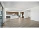 Open concept living room with tile flooring and views into the kitchen at 11464 E Utah Ave, Mesa, AZ 85212