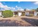 Landscaped backyard with gravel and shrubs at 12611 W Gable Hill Dr, Sun City West, AZ 85375