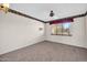 Bright bedroom with ceiling fan and window coverings at 12611 W Gable Hill Dr, Sun City West, AZ 85375