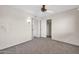 Bedroom with ceiling fan and closet at 12611 W Gable Hill Dr, Sun City West, AZ 85375