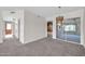 Bright dining area with a view into a Gathering room and access to a patio at 12611 W Gable Hill Dr, Sun City West, AZ 85375