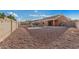 Large backyard with gravel landscaping and playset at 13407 N Primrose St, El Mirage, AZ 85335