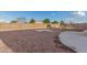 Landscaped backyard with gravel and a playset at 13407 N Primrose St, El Mirage, AZ 85335